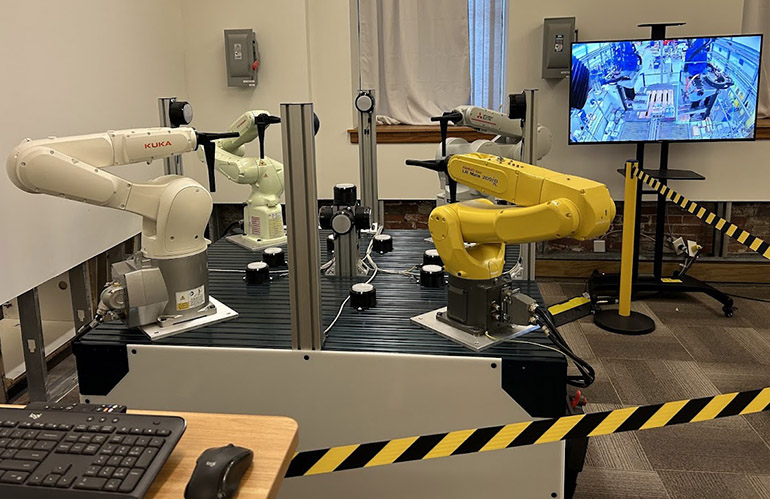 Realtime Robotics demonstrates a multi-robot workcell during Mitsubishi Electric's visit to its headquarters.